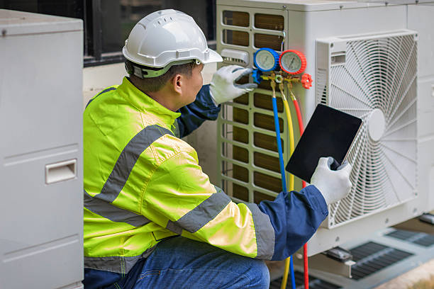 Professional Air Conditioning Repair technician working in Greens Fork, IN